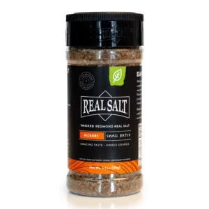 A bottle of Real Salt seasoned salt with orange label.