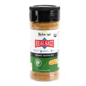 A bottle of Badia Real Salt with garlic powder seasoning.